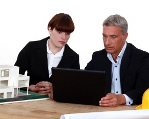 architect and colleague with model housing