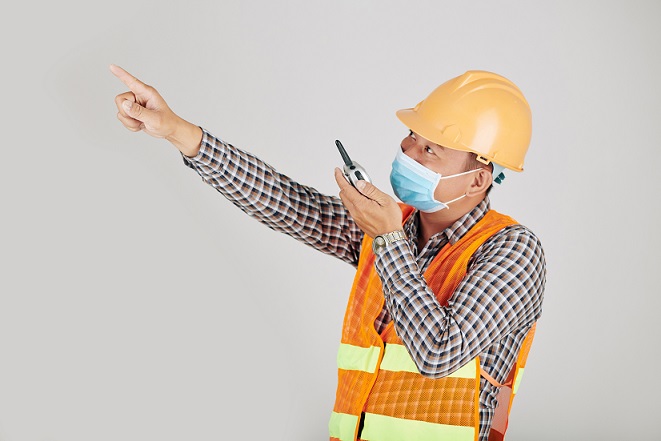 contractor wearing mask on construction site