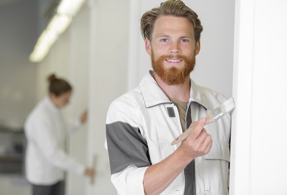 painter painting door frame